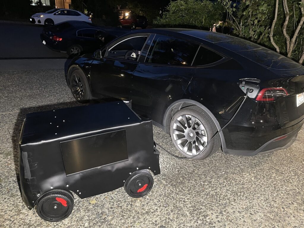 a black car with a black box on the side