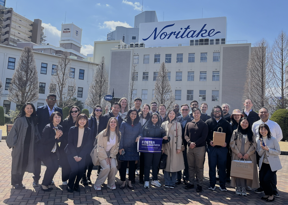 Foster MBA students gather together outside Noritak