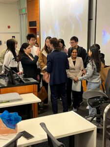 Foster School of Business Master of Science in Information Science students celebrate the successful completion of their projects.