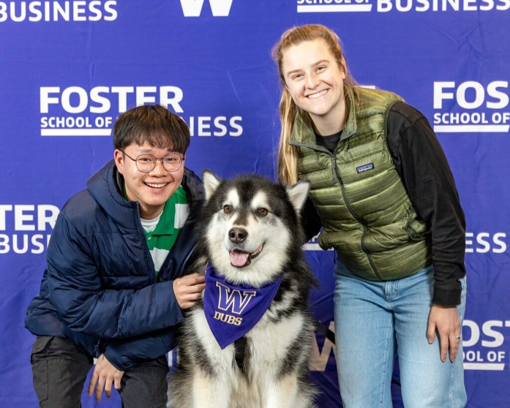 Bridget Bills (right) with a Foster MSBA classmate at a networking event with a twist: the opportunity to meet Dubs, the University of Washington mascot.