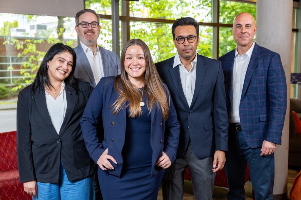 Melinda Yormick (center) together with fellow Executive MBA students following a successful business plan competition