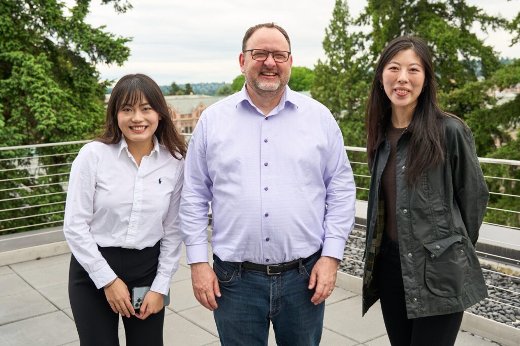 MSCM students Shijie Chen (left) and Fei Sun (right) with their mentor, Odin Bazeley (center).
