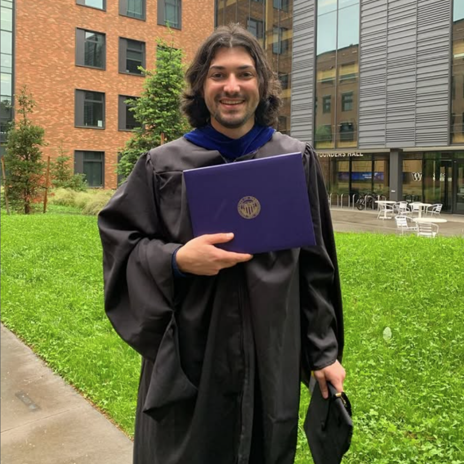 Kain Coronado celebrates receiving his Master of Science in Taxation degree.