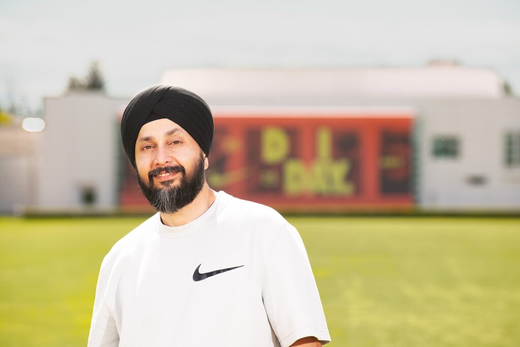 Raminder Chadha on the Nike campus in Beaverton, Oregon, photographed on a hot summer day. He earned his Executive MBA at the Foster School of Business.