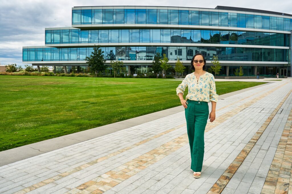 Shiyi Pickrell walks purposefully across the modern grounds of Expedia Group’s headquarters. 